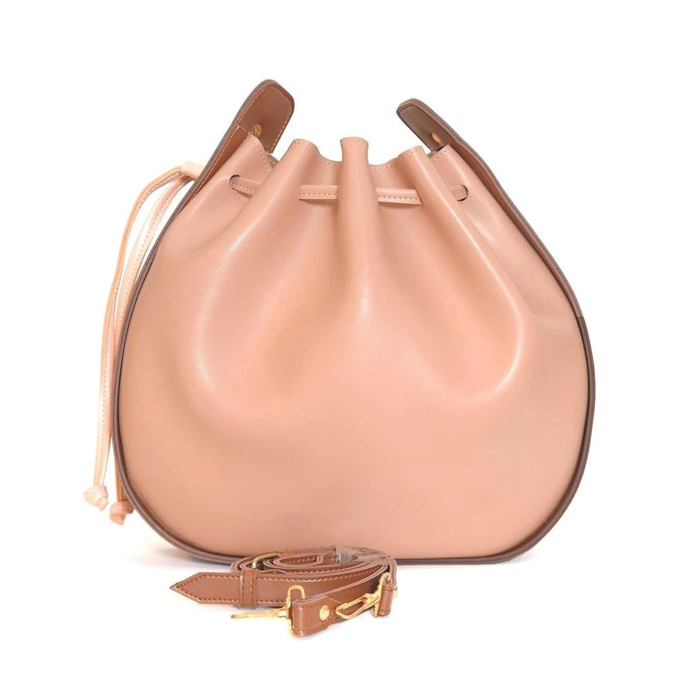 Beige leather handbag with brown strap on a white background