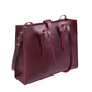 Maroon handbag with gold hardware on a white background