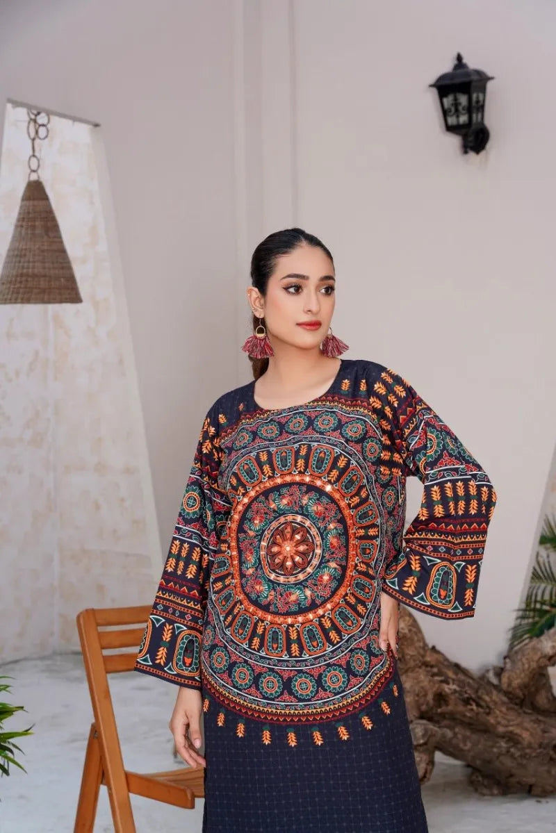 Woman wearing a colorful patterned top in an indoor setting