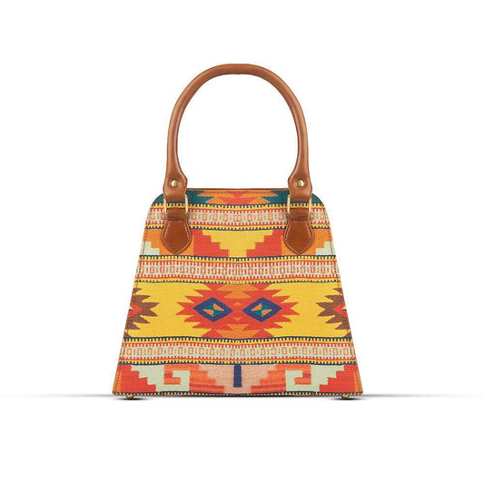 Colorful patterned handbag with brown handles on a white background