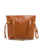brown croc-textured faux leather tote bag with gold accents and shoulder handles