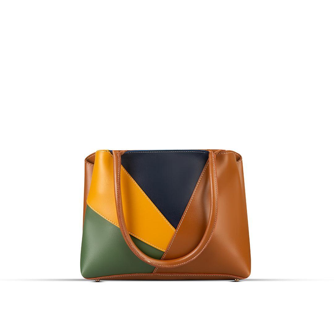 Multicolored handbag with brown, yellow, and green sections on a white background